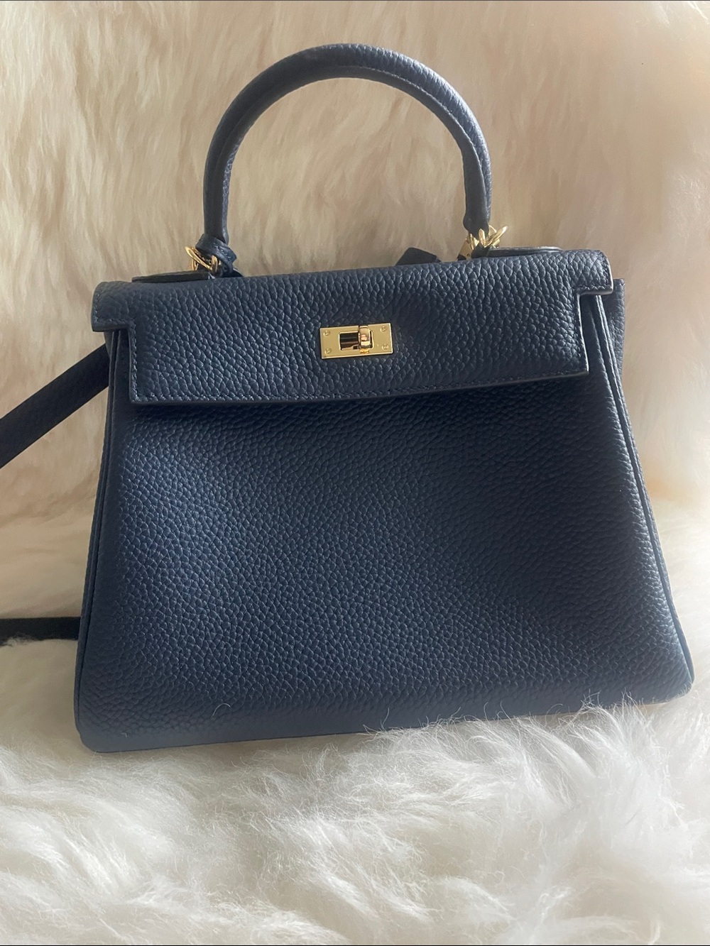 Togo leather navy top handle with long strap handbag